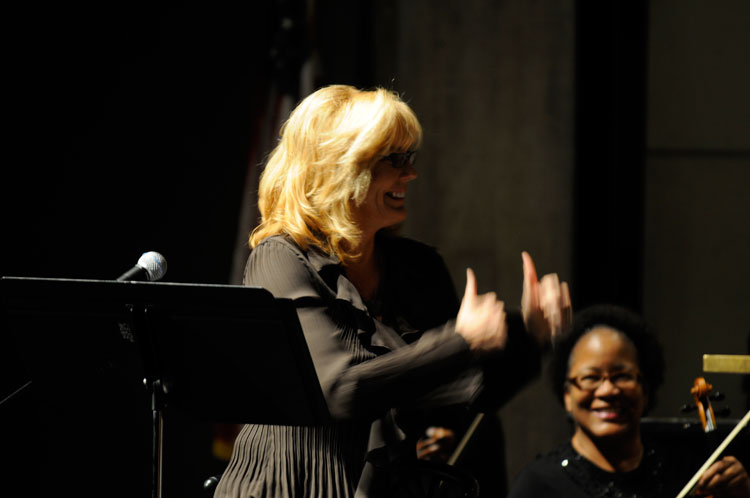 Karen Sharp congratulates the orchestra